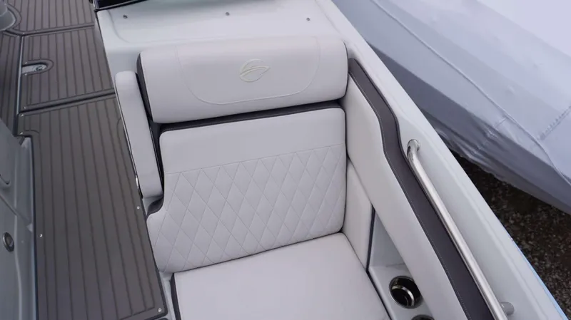 Slide: The Image of 2024 Crownline 260 XS boat seat with diamond-stitched upholstery and armrest. - 26