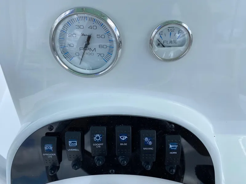 Slide: The Image of Dashboard of a 2023 Savannah SS21 boat with RPM and fuel gauges. - 11