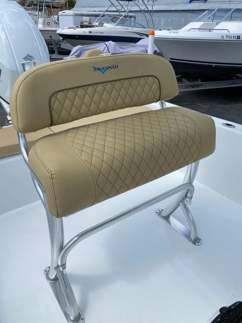 Slide: The Image of Savannah SS21 2023 boat seat with beige diamond-stitched upholstery and stainless steel frame. - 13