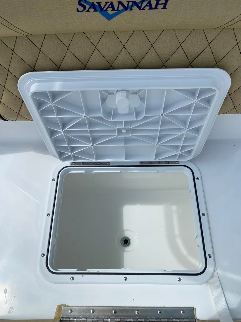 Slide: The Image of Open storage compartment on a 2023 Savannah SS21 boat. - 15