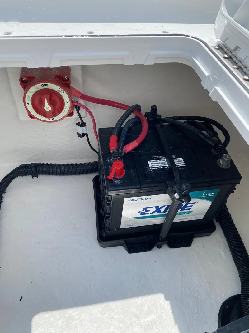 Slide: The Image of Battery compartment of a 2023 Savannah SS21 boat with Exide marine battery. - 25