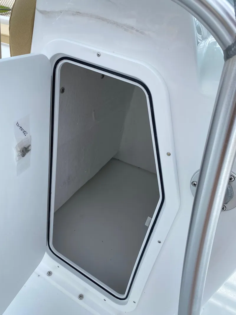 Slide: The Image of 2023 Savannah SS21 boat storage compartment with open door. - 28