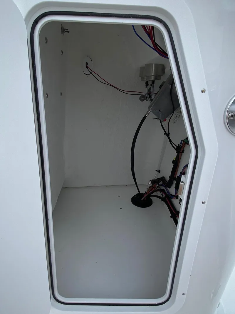 Slide: The Image of Interior compartment of 2023 Savannah SS21 boat with wiring and components. - 29
