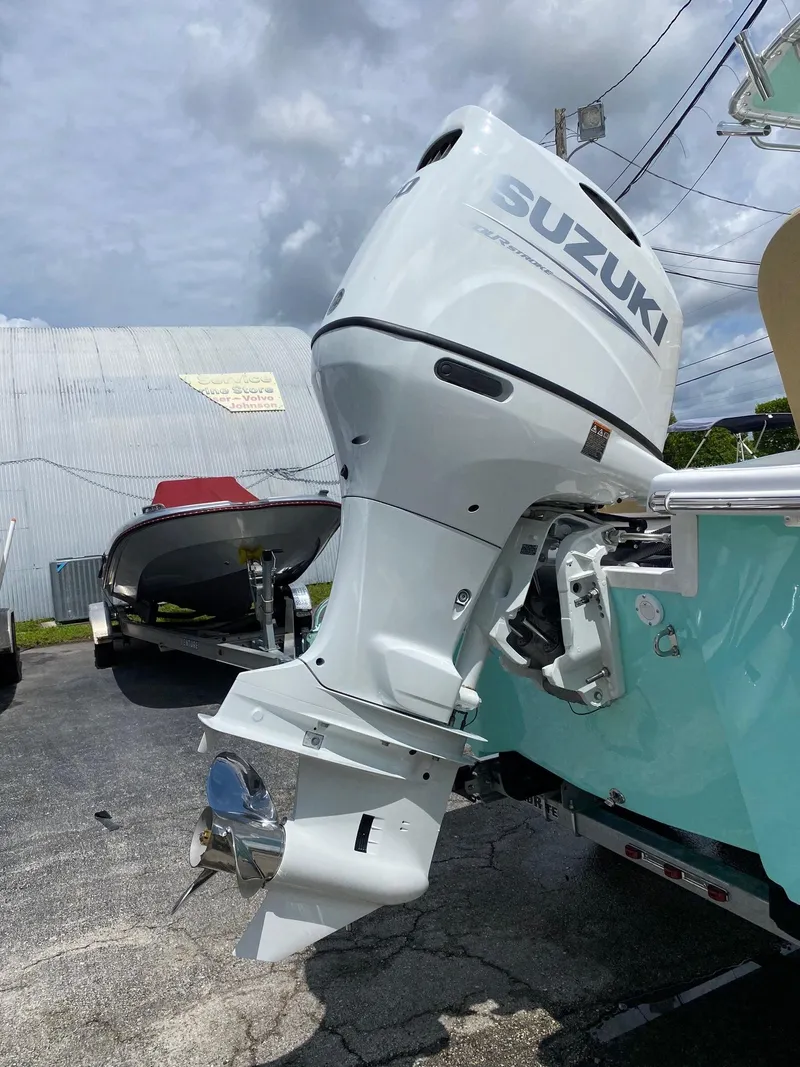 Slide: The Image of 2023 Savannah SS21 boat with Suzuki outboard motor. - 32