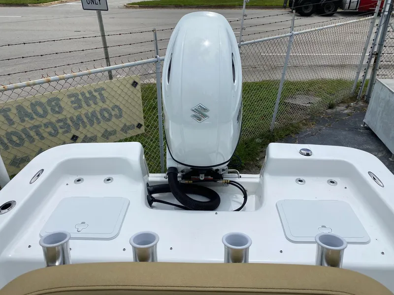 Slide: The Image of 2023 Savannah SS21 boat with outboard motor and rod holders. - 35