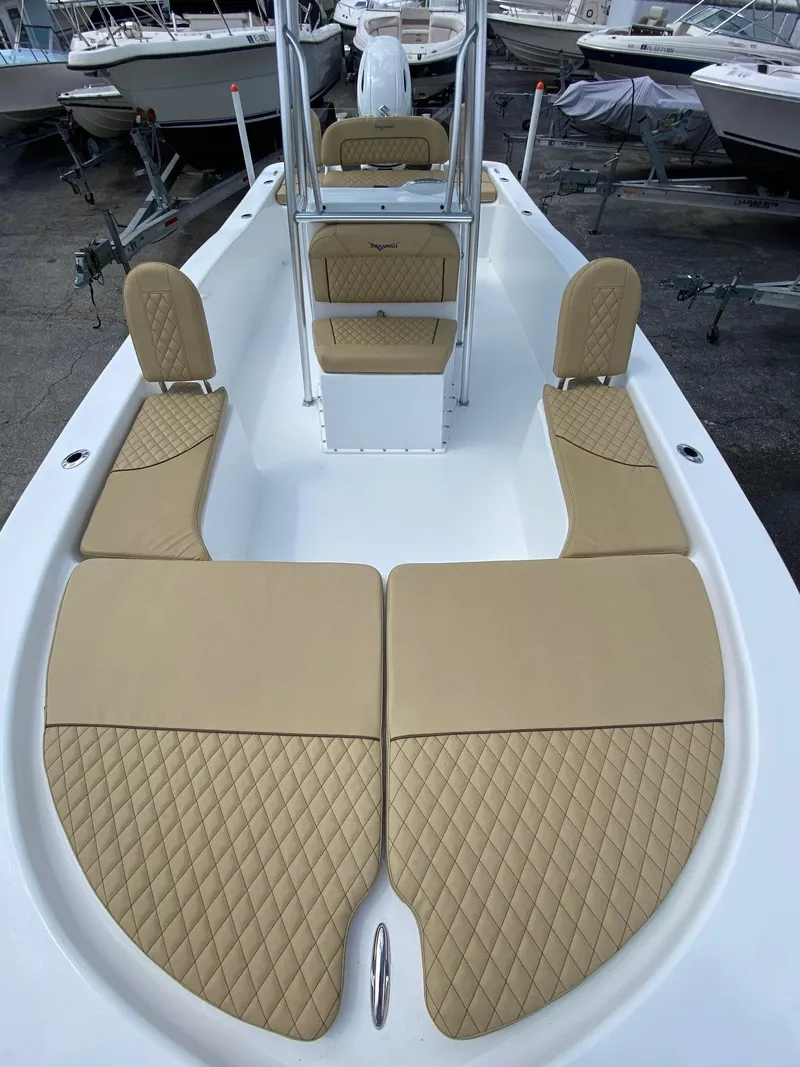 Slide: The Image of 2023 Savannah SS21 boat with tan diamond-stitched seating and white deck. - 7