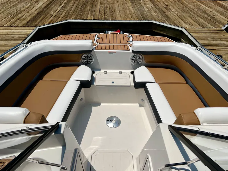 Slide: The Image of 2023 Starcraft SVX 210 IO boat interior with tan and white seating. - 5
