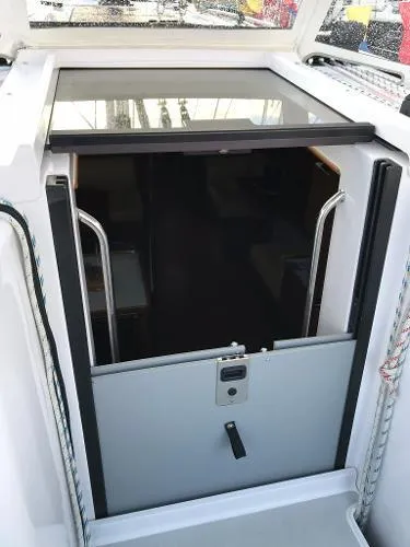 Slide: The Image of 2018 Catalina 425 yacht cabin entrance with sliding hatch and secure door. - 14