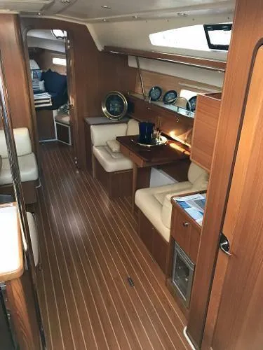 Slide: The Image of Interior of 2018 Catalina 425 yacht with elegant wood finish and cozy seating area. - 16