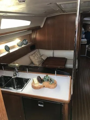 Slide: The Image of Interior of 2018 Catalina 425 yacht with cozy seating and modern kitchen amenities. - 17