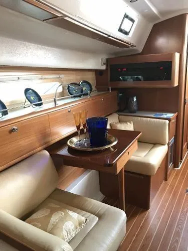 Slide: The Image of Interior of 2018 Catalina 425 yacht with elegant seating and wooden finishes. - 24