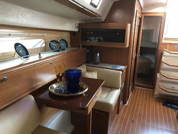 Slide: The Image of Luxurious interior of a 2018 Catalina 425 yacht with elegant wood finish and seating area. - 29