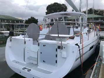 Slide: The Image of 2018 Catalina 425 sailboat docked at marina, featuring spacious deck and modern design. - 5