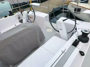 Slide: The Image of 2018 Catalina 425 yacht cockpit with dual steering wheels and covered seating area. - 8