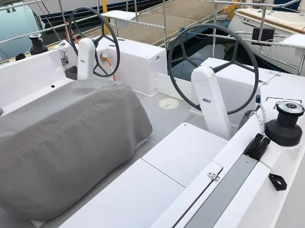 Slide: The Image of Cockpit of 2018 Catalina 425 sailboat with dual steering wheels and covered seating. - 9
