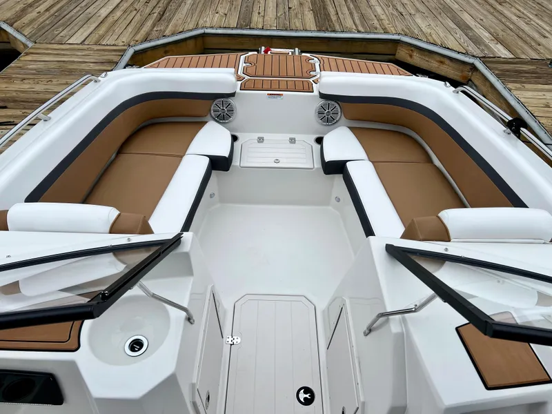 Slide: The Image of 2023 Starcraft SVX 210 IO Wake Tower boat interior with tan seating. - 5