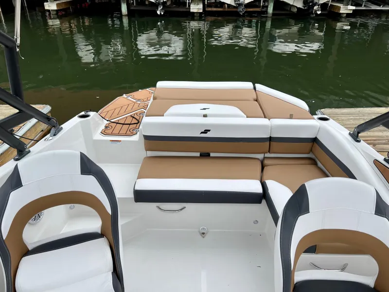Slide: The Image of 2023 Starcraft SVX 210 IO Wake Tower boat interior with tan and white seating. - 6