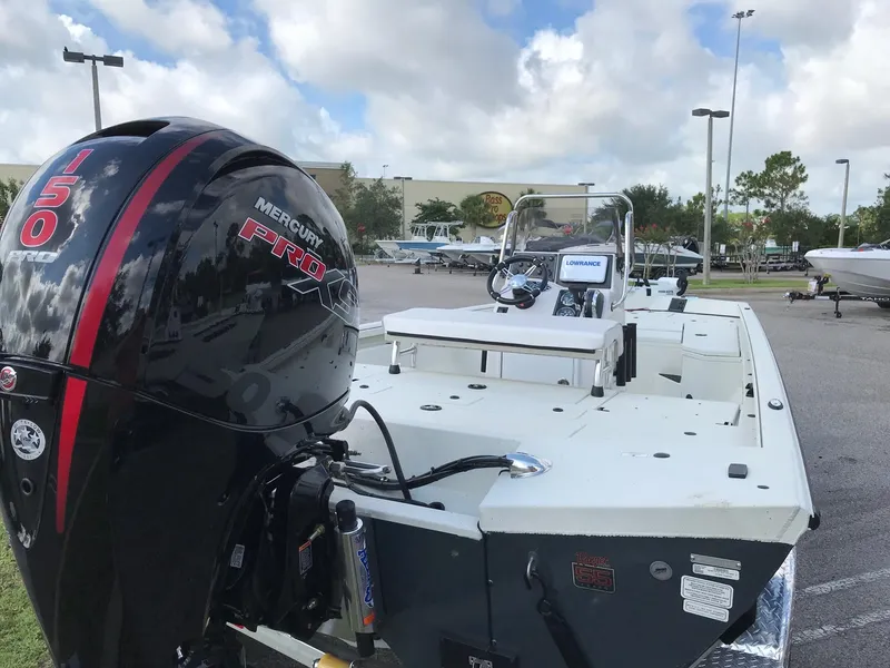 Slide: The Image of 2023 Ranger RB200 boat with Mercury 150 engine in outdoor setting. - 3