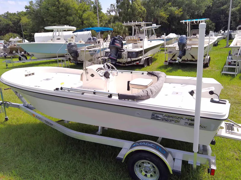 Slide: The Image of 2023 Carolina Skiff 162 JLS boat on trailer, displayed outdoors. - 3