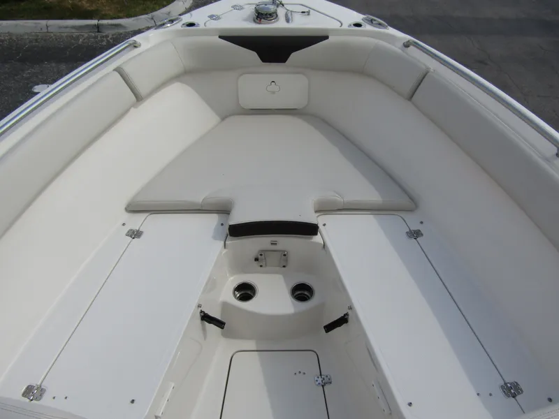 Slide: The Image of 2024 Sailfish 242 CC boat interior, spacious seating and storage compartments. - 10