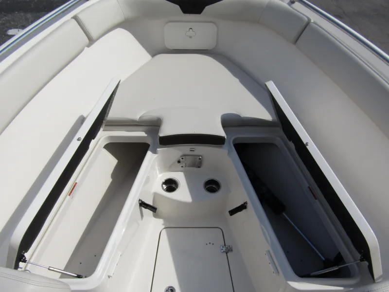 Slide: The Image of 2024 Sailfish 242 CC boat interior with open storage compartments. - 11