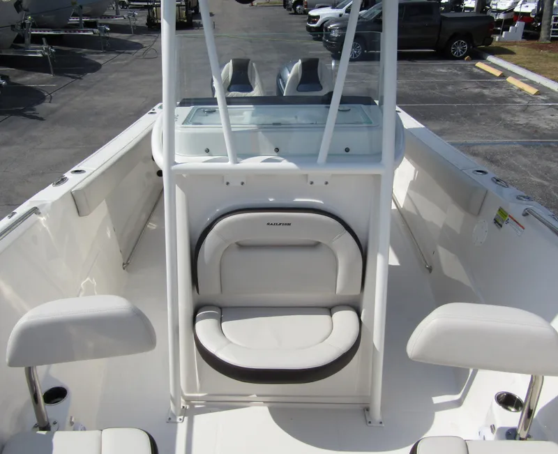 Slide: The Image of 2024 Sailfish 242 CC center console boat interior with seating and windshield. - 13