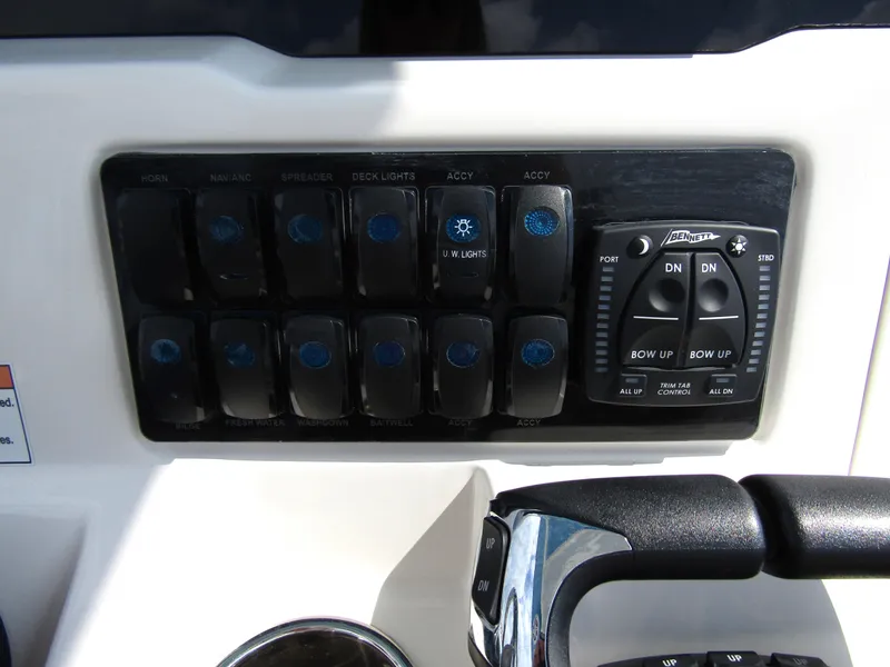 Slide: The Image of Control panel of 2024 Sailfish 242 CC boat with switches and joystick. - 25