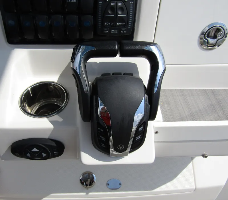 Slide: The Image of Close-up of the 2024 Sailfish 242 CC boat's throttle control system. - 26