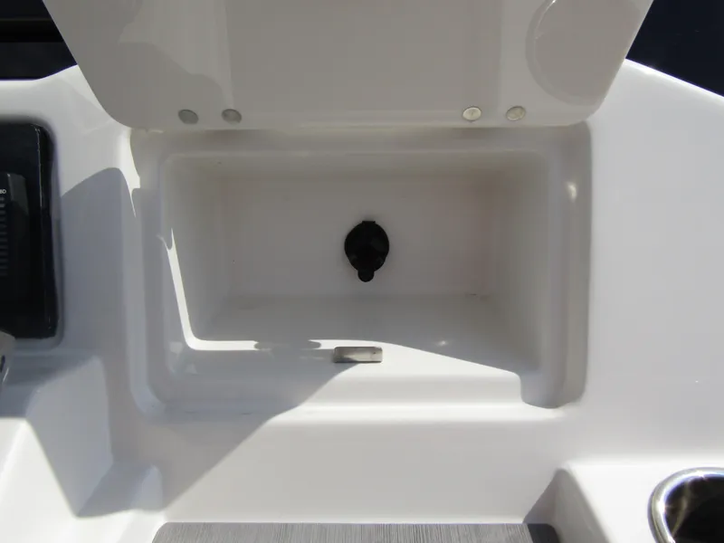 Slide: The Image of Open storage compartment on 2024 Sailfish 242 CC boat. - 28