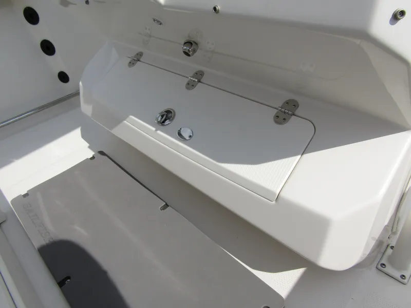 Slide: The Image of 2024 Sailfish 242 CC boat storage compartment and deck area. - 29