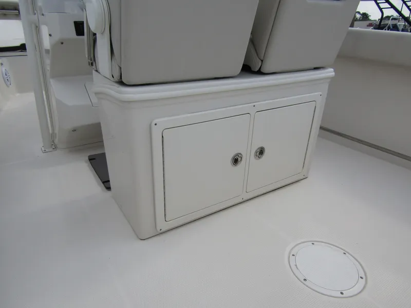 Slide: The Image of 2024 Sailfish 242 CC boat storage compartment and seating area. - 36