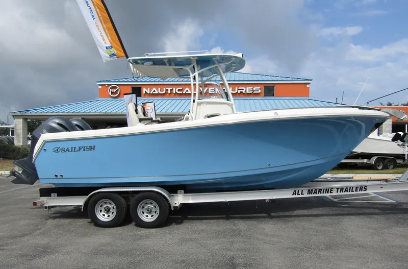 Slide: The Image of 2024 Sailfish 242 CC boat on trailer at Nautical Ventures dealership. - 4