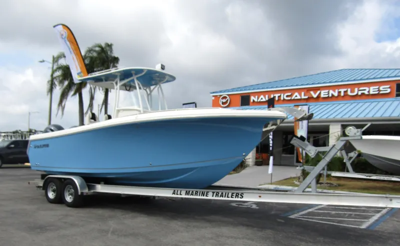 Slide: The Image of 2024 Sailfish 242 CC boat on trailer at Nautical Ventures dealership. - 5