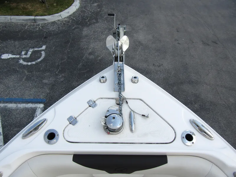 Slide: The Image of Bow view of 2024 Sailfish 242 CC boat with anchor and deck fittings. - 7