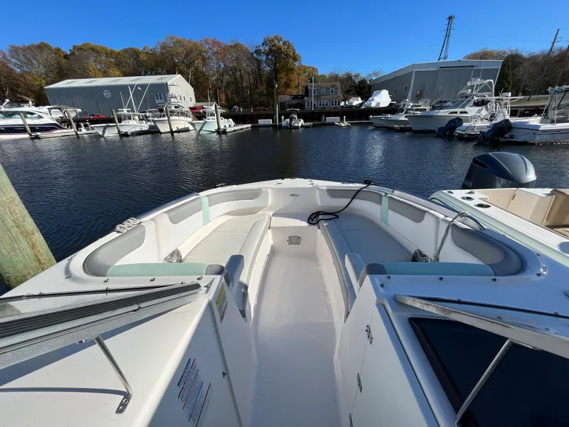 Slide: The Image of 2020 Chaparral Suncoast 250 boat docked at a marina. - 7