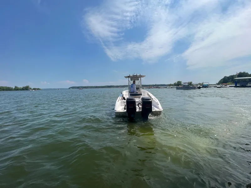 Slide: The Image of 1999 Donzi 30 ZF boat on a sunny lake. - 14