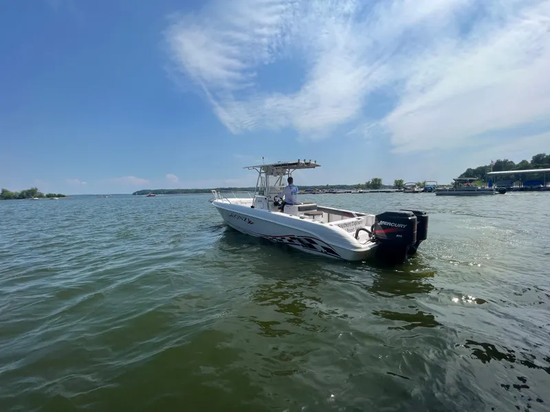 Slide: The Image of 1999 Donzi 30 ZF boat cruising on a sunny day. - 15