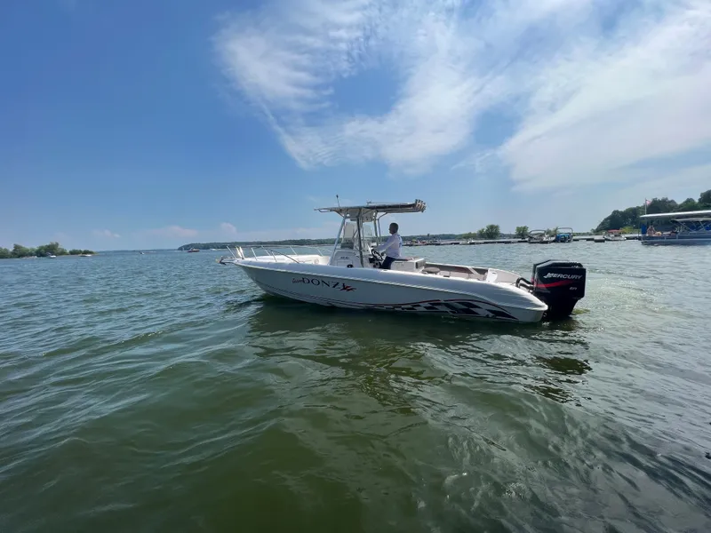 Slide: The Image of 1999 Donzi 30 ZF boat on a sunny lake. - 16