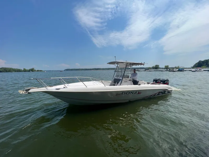 Slide: The Image of 1999 Donzi 30 ZF boat on a sunny lake. - 18