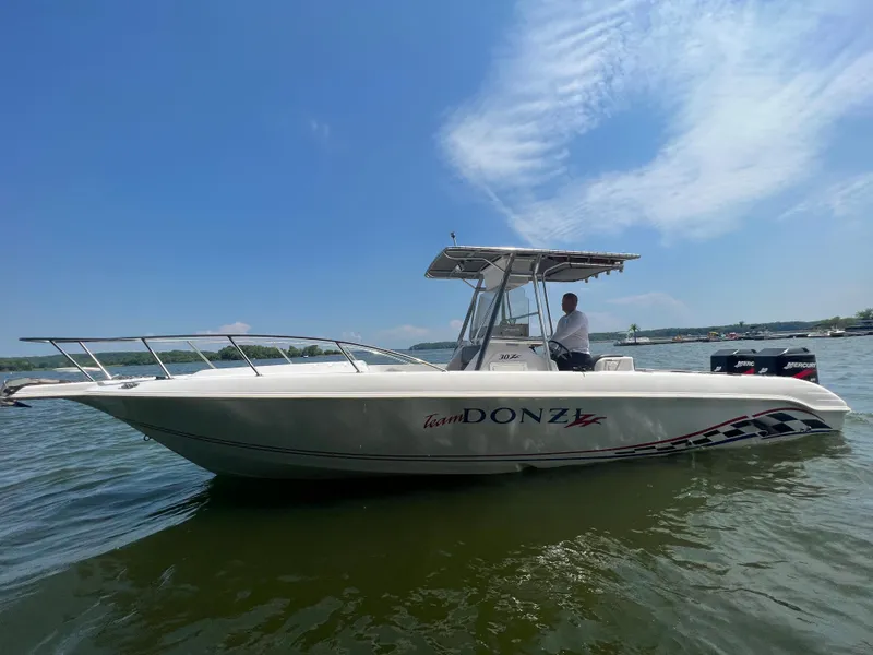Slide: The Image of 1999 Donzi 30 ZF boat on water with clear blue sky. - 19