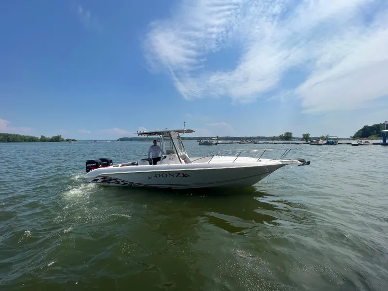 Slide: The Image of 1999 Donzi 30 ZF boat cruising on a sunny day. - 3