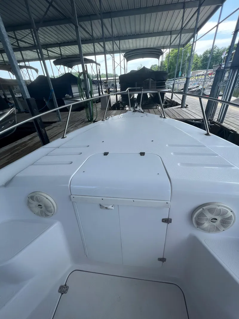 Slide: The Image of 1999 Donzi 30 ZF boat docked in a covered marina. - 30