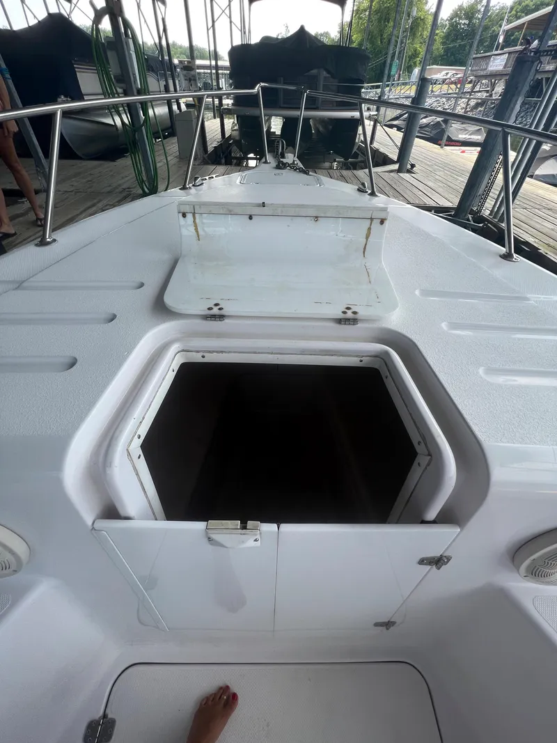 Slide: The Image of 1999 Donzi 30 ZF boat deck with open hatch. - 31