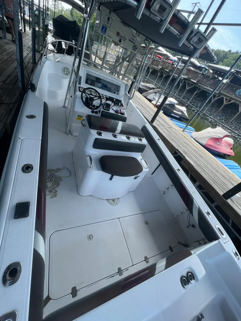 Slide: The Image of 1999 Donzi 30 ZF boat interior with helm and seating. - 33