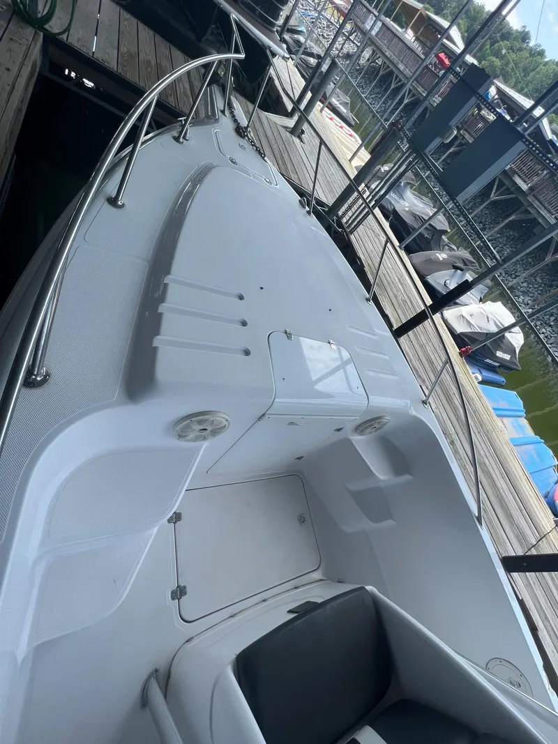 Slide: The Image of 1999 Donzi 30 ZF boat docked at a marina. - 37