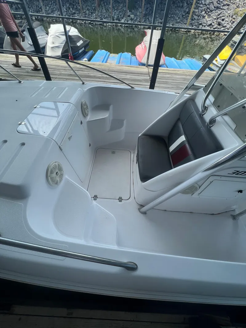Slide: The Image of 1999 Donzi 30 ZF boat interior with seating and storage compartments. - 47