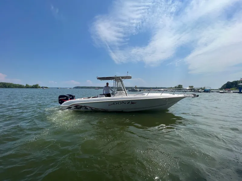 Slide: The Image of 1999 Donzi 30 ZF boat cruising on a sunny day. - 5