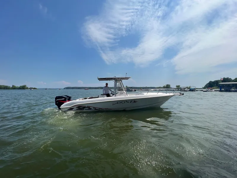 Slide: The Image of 1999 Donzi 30 ZF boat cruising on a sunny day. - 7