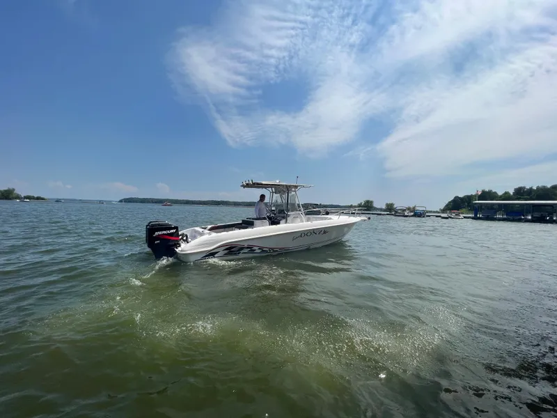 Slide: The Image of 1999 Donzi 30 ZF boat cruising on a sunny day. - 9