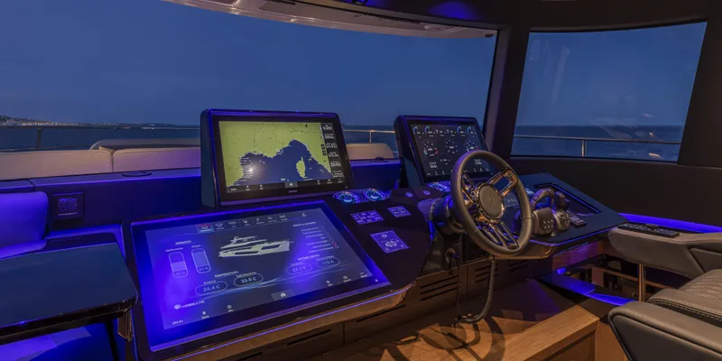 Slide: The Image of Luxurious 2025 Absolute NAVETTA 75 yacht cockpit with advanced navigation systems. - 27